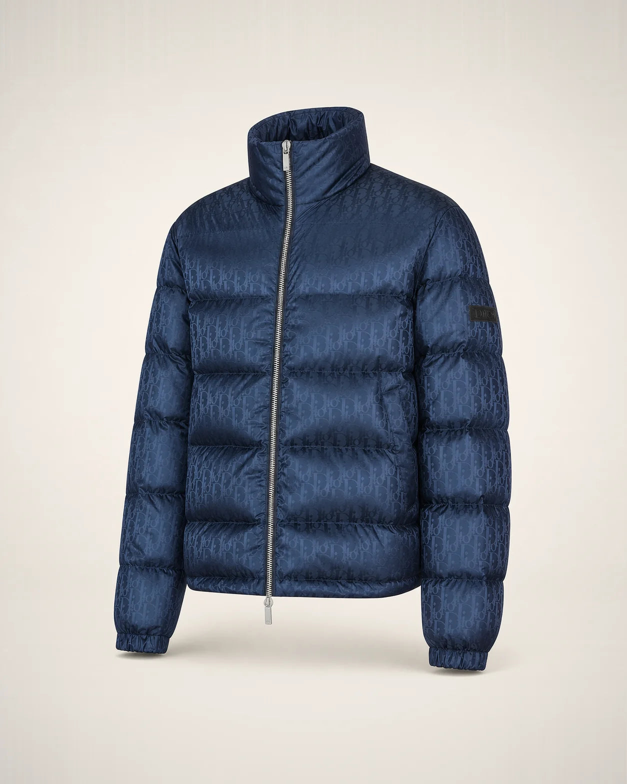 Puffer azul marino con jacquard Oblique tonal, cuello alto y cierre plateado.