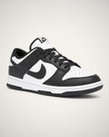 Dunk Low blanco y negro con paneles de piel contrastantes, mediasuela blanca y outsole negro.